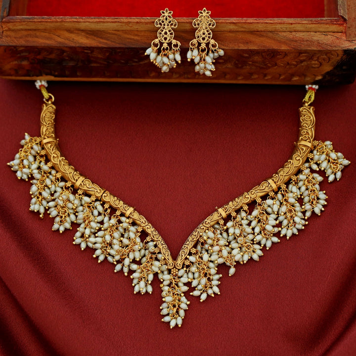 Arundhathi Hanging Cluster Pearl Stiff Wing Neckpiece With Earring