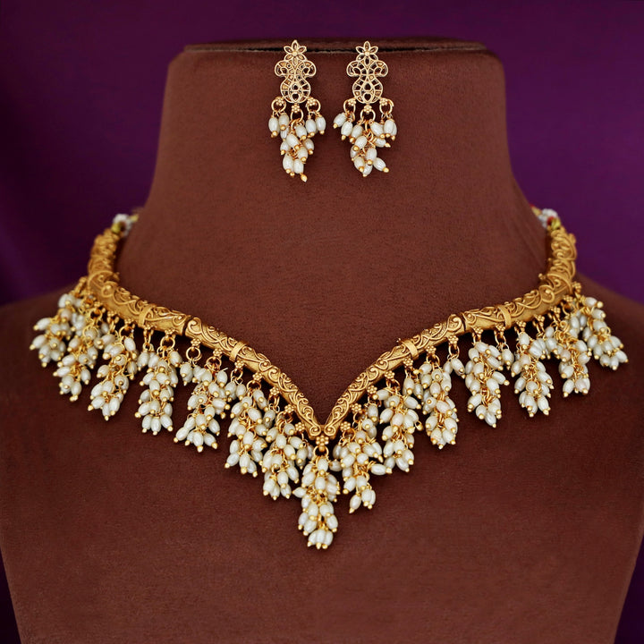 Arundhathi Hanging Cluster Pearl Stiff Wing Neckpiece With Earring
